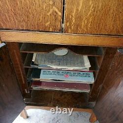 Antique 1900s Victor Victrola phonograph cabinet record player with records