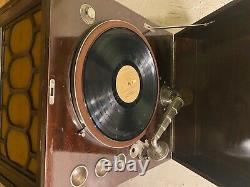 Old victrola record player and about 50 + old records
